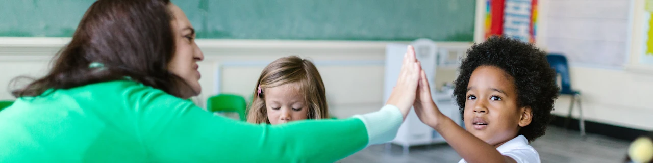 Teaching assistant helping student