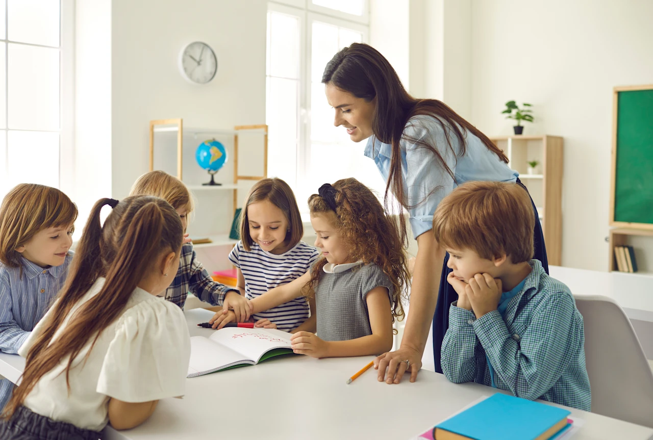 Female teacher in classroom with children